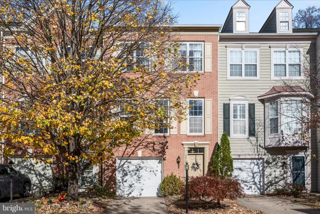 a view of a city street lined with buildings and trees