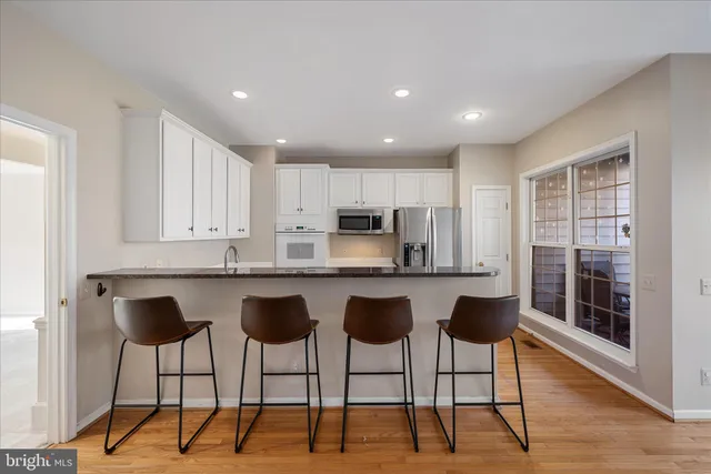a view of a living room and balcony