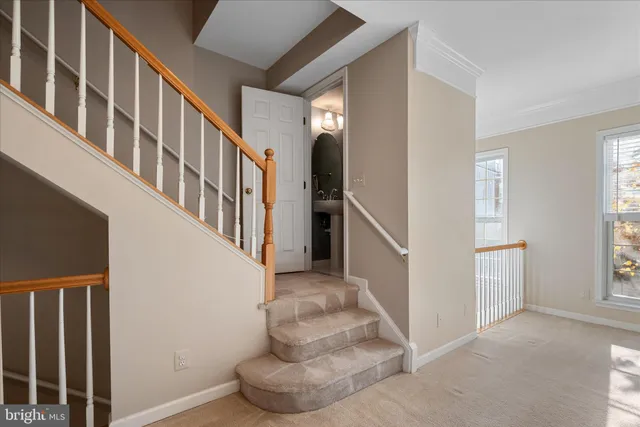 an empty room with chandelier fan