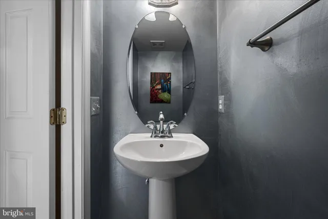 a view of a room with wooden walls and windows