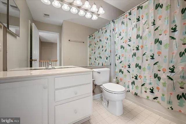 a view of an empty room with a fireplace