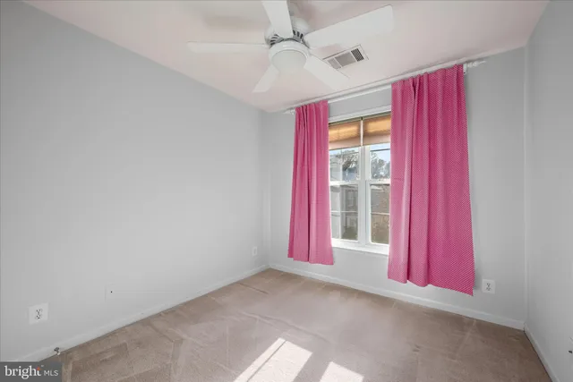 a view of an empty room with a fireplace