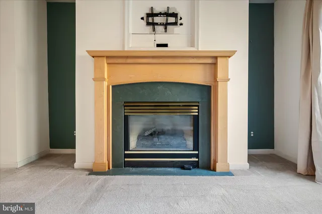 a view of a house with a chairs and table in a patio