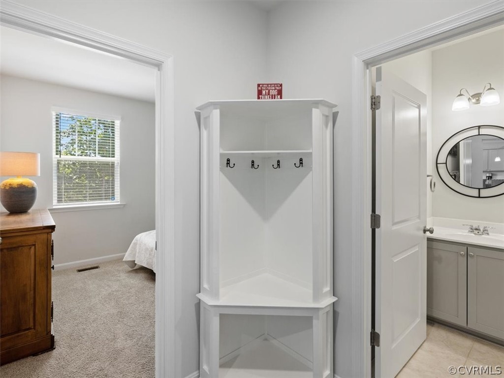 1413 Braisden Road Midlothian, VA 23114 - Photo 18 of 37 a room with a refrigerator and a dresser