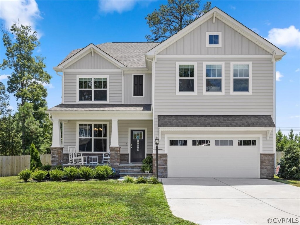 1413 Braisden Road Midlothian, VA 23114 - Photo 2 of 37 a front view of a house with a yard and garage