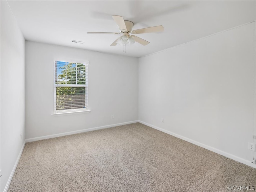 1413 Braisden Road Midlothian, VA 23114 - Photo 24 of 37 an empty room with a window and a fan