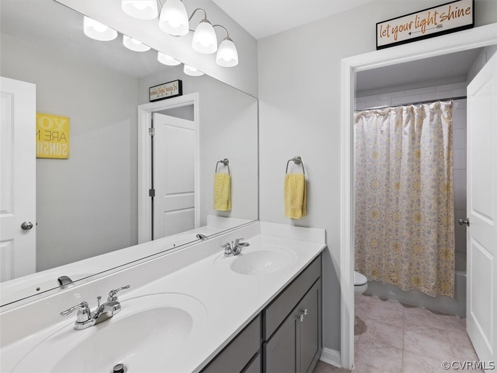 1413 Braisden Road Midlothian, VA 23114 - Photo 25 of 37 a bathroom with a sink vanity and a mirror