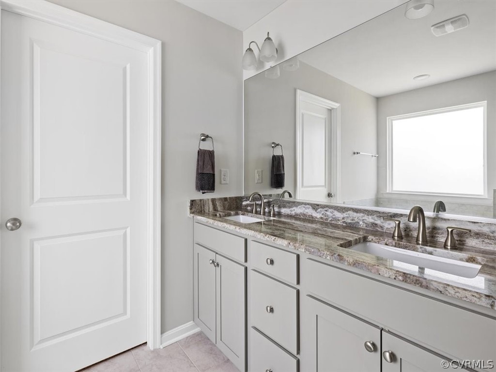 1413 Braisden Road Midlothian, VA 23114 - Photo 32 of 37 a bathroom with a double vanity sink and a mirror