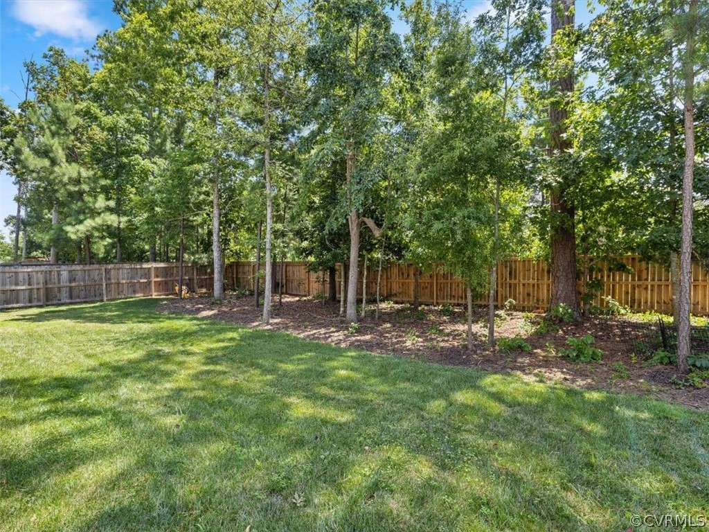 1413 Braisden Road Midlothian, VA 23114 - Photo 36 of 37 a view of a backyard with a trees