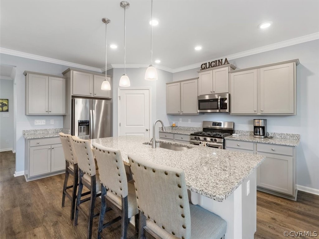 1413 Braisden Road Midlothian, VA 23114 - Photo 9 of 37 a kitchen with kitchen island granite countertop white cabinets and stainless steel appliances