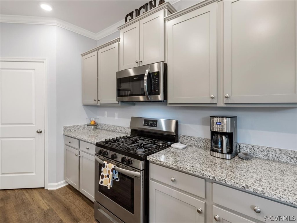 1413 Braisden Road Midlothian, VA 23114 - Photo 10 of 37 a kitchen with stainless steel appliances granite countertop white cabinets sink and stove
