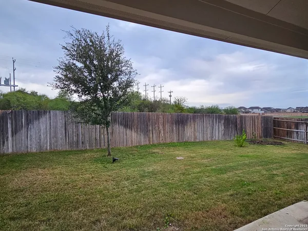 a garden with wooden fence