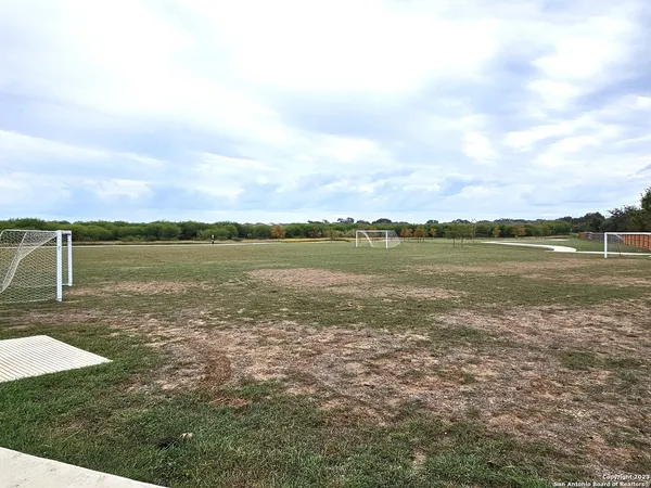 a view of a lake with houses in the back