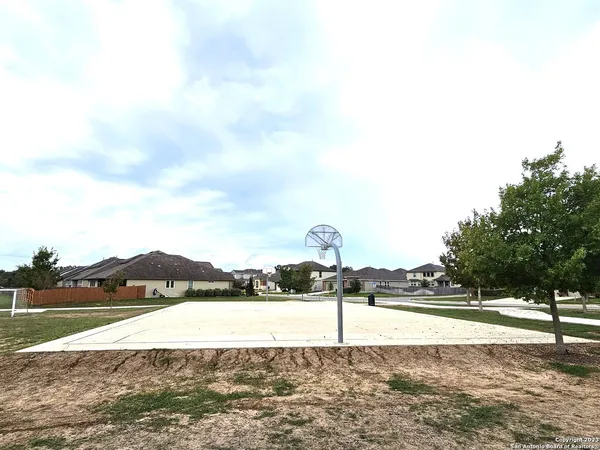 a view of a street with a yard
