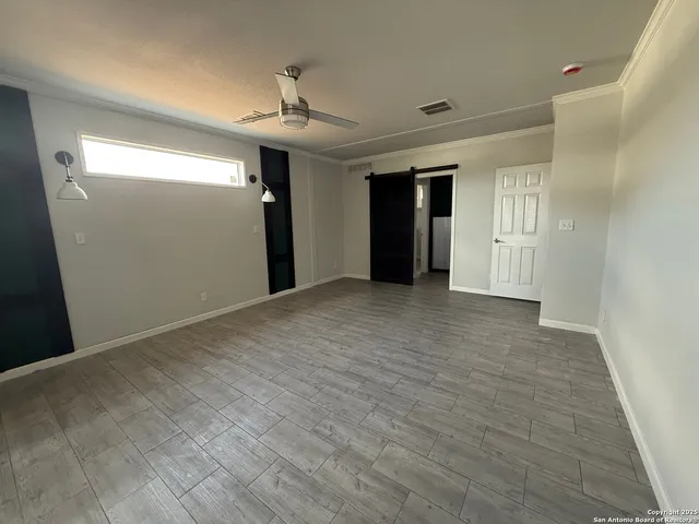 a view of a livingroom with wooden floor