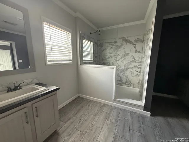 a view of a house with backyard and barbeque oven