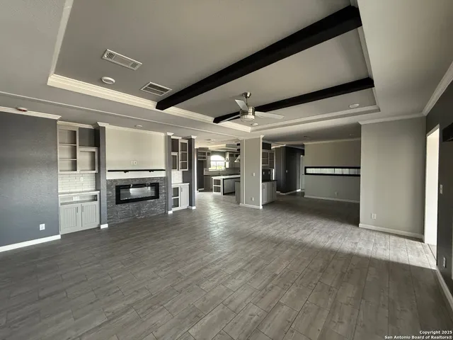 a view of a livingroom with furniture and wooden floor