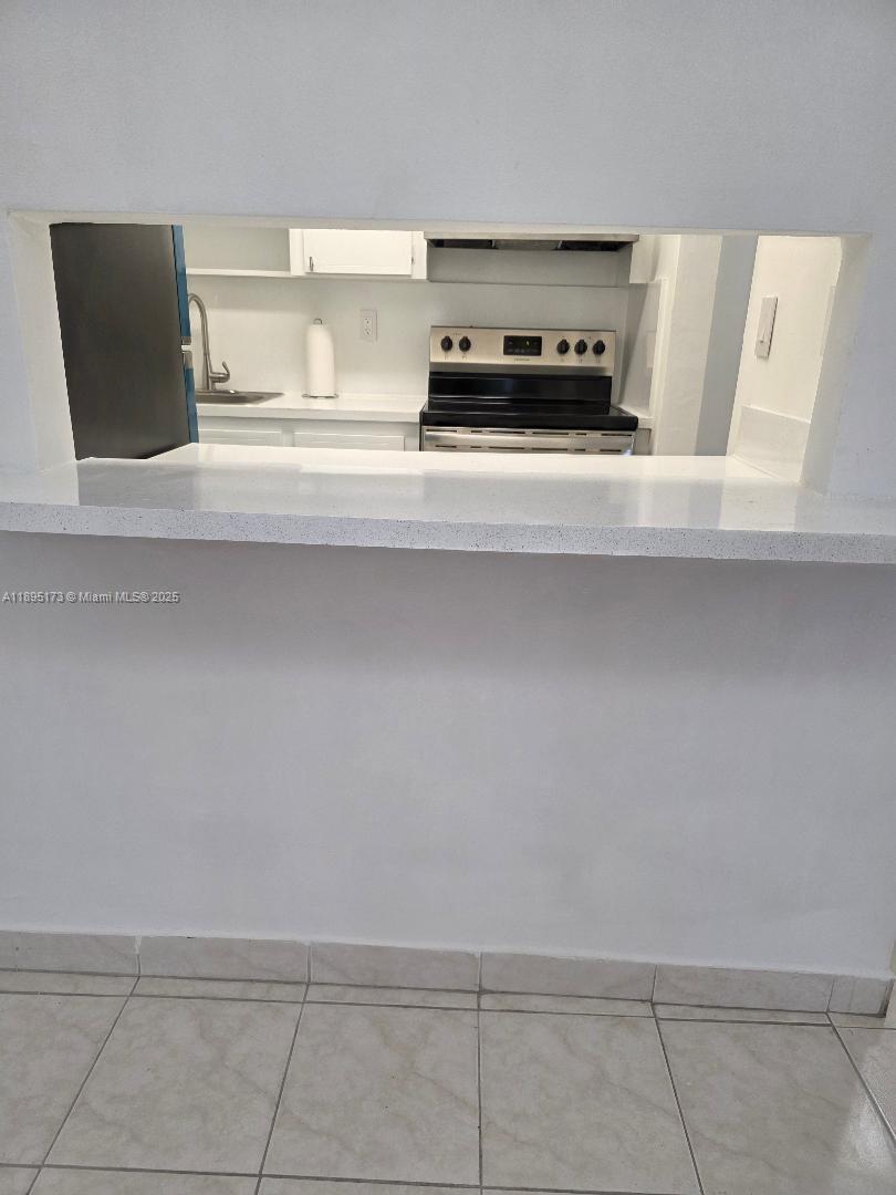 677 Southwest 9th Avenue, Unit 205 Miami, FL 33130 - Photo 12 of 27 a view of kitchen and microwave