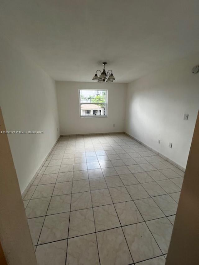 677 Southwest 9th Avenue, Unit 205 Miami, FL 33130 - Photo 14 of 27 an empty room with windows and fireplace