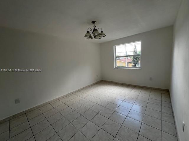 677 Southwest 9th Avenue, Unit 205 Miami, FL 33130 - Photo 16 of 27 an empty room with windows