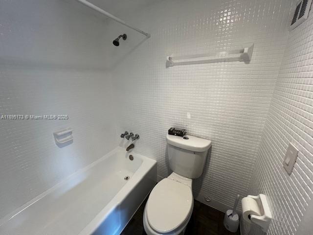 677 Southwest 9th Avenue, Unit 205 Miami, FL 33130 - Photo 17 of 27 a white toilet and a shower in a bathroom