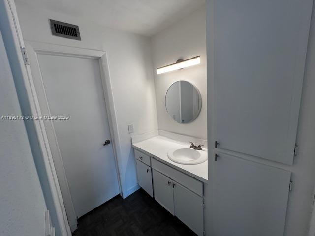 677 Southwest 9th Avenue, Unit 205 Miami, FL 33130 - Photo 19 of 27 a bathroom with a sink and a mirror