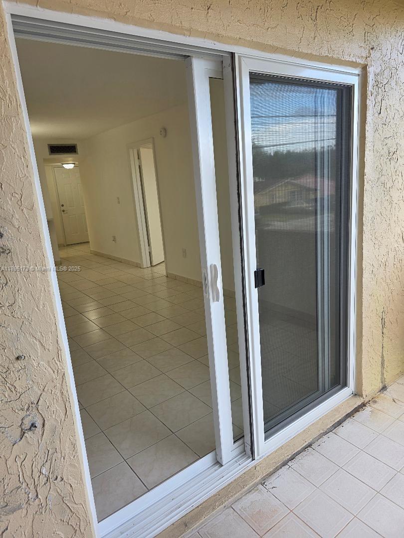 677 Southwest 9th Avenue, Unit 205 Miami, FL 33130 - Photo 21 of 27 view of a room with door