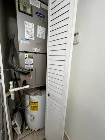 a kitchen with a cabinets and white appliances