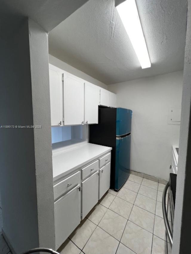 677 Southwest 9th Avenue, Unit 205 Miami, FL 33130 - Photo 8 of 27 a kitchen with a cabinets and white appliances