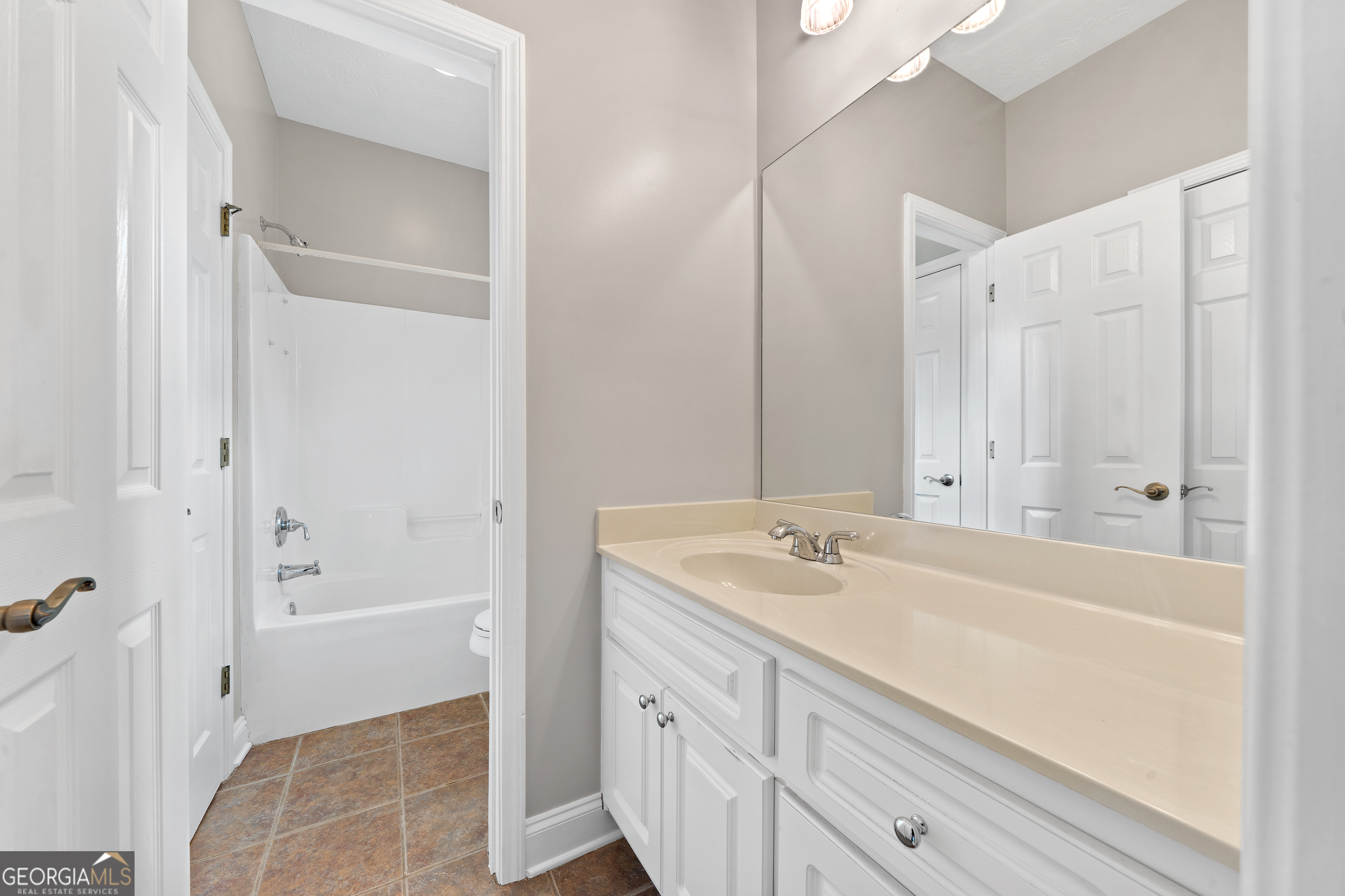 1041 Holstein Road Buckhead, GA 30625 - Photo 23 of 49 a bathroom with a tub sink and mirror