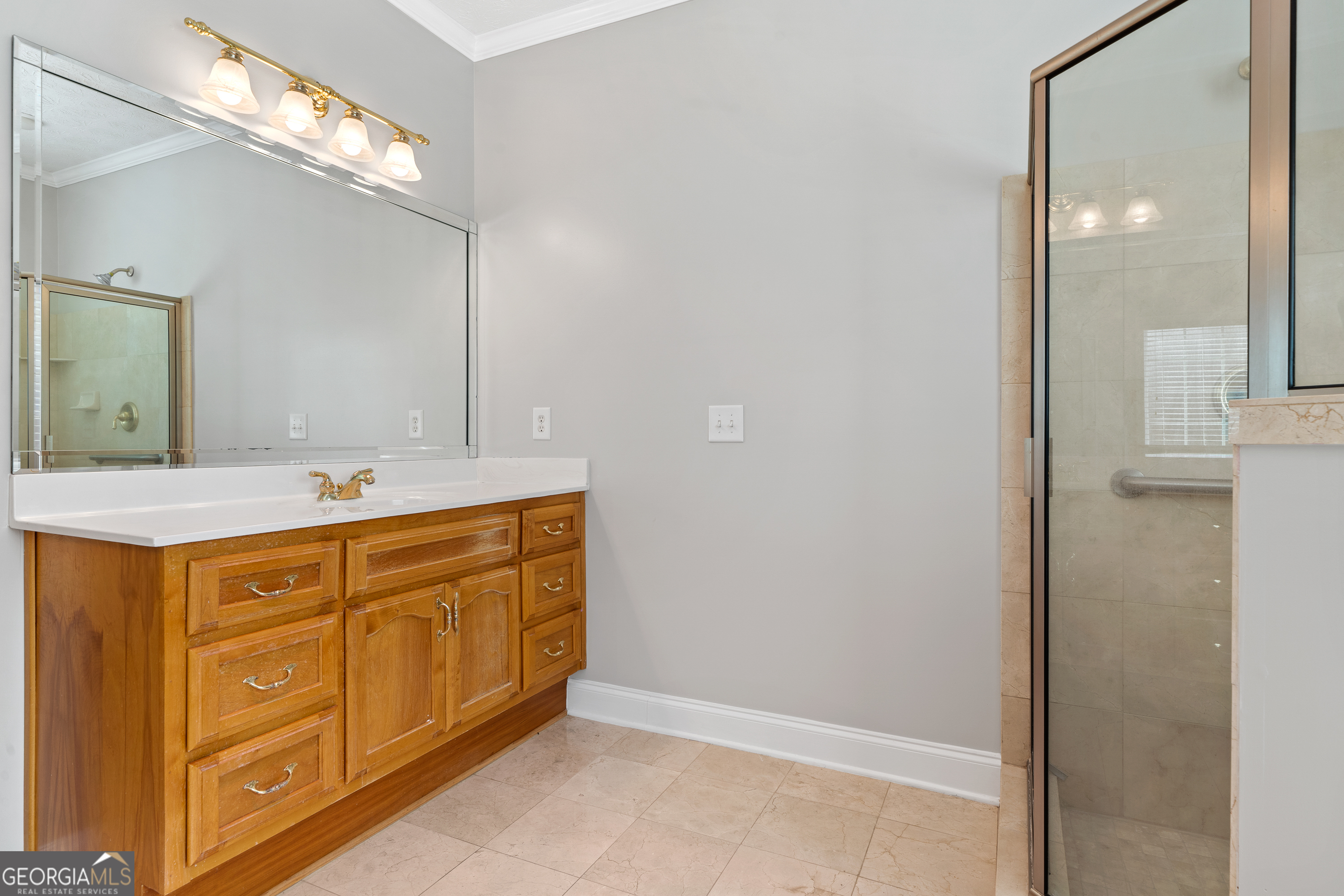 1041 Holstein Road Buckhead, GA 30625 - Photo 28 of 49 a spacious bathroom with a double vanity sink and a mirror