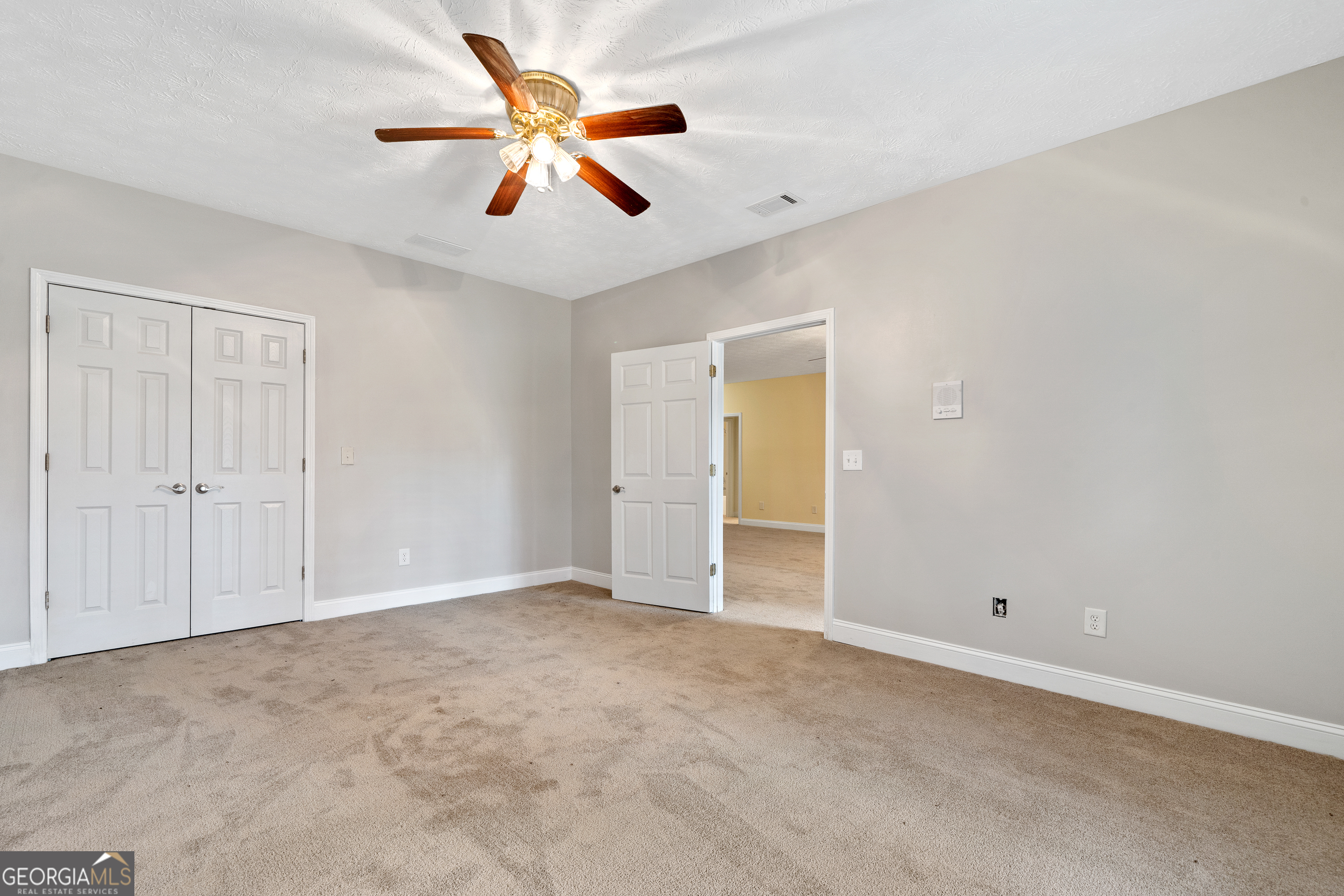 1041 Holstein Road Buckhead, GA 30625 - Photo 44 of 49 an empty room with closet and fan