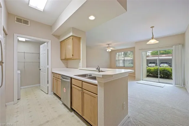 a kitchen with a stove and a sink