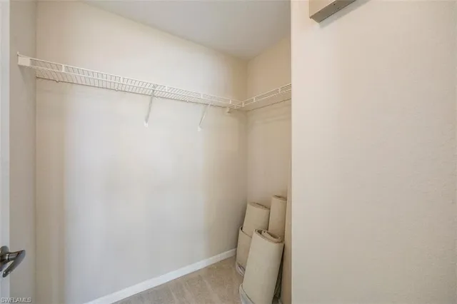 a white toilet sitting next to a shower