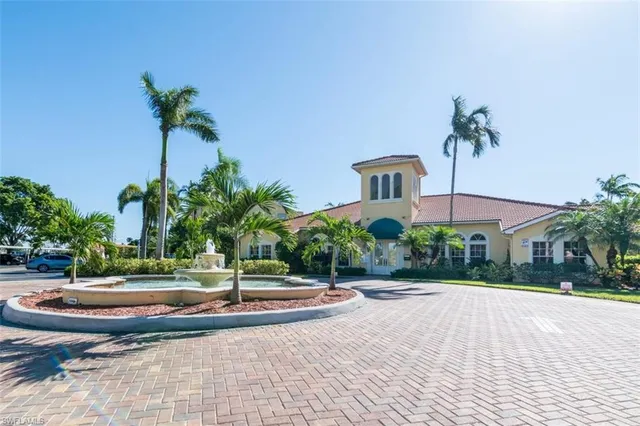 a view of a building with palm trees