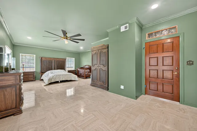 a living room with furniture ceiling fan and a window