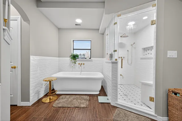 a spacious bathroom with a double vanity sink and a mirror