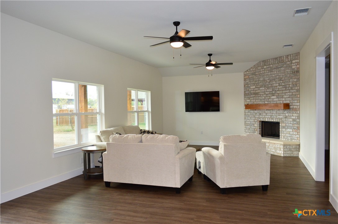 425 County Road 3152 Kempner, TX 76539 - Photo 11 of 48 a living room with furniture fireplace and flat screen tv