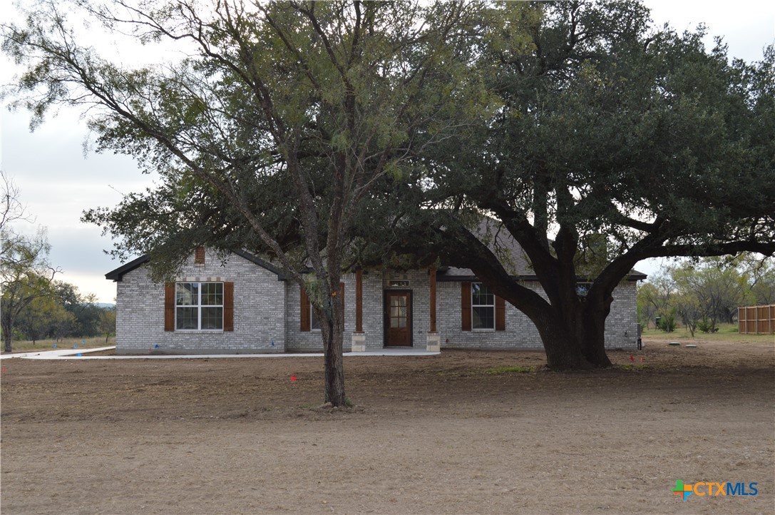 425 County Road 3152 Kempner, TX 76539 - Photo 2 of 48 a house with a tree in front of it