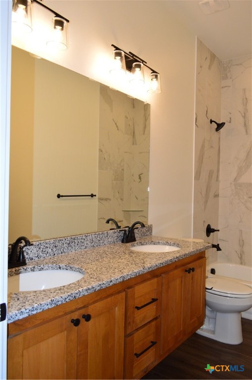 425 County Road 3152 Kempner, TX 76539 - Photo 35 of 48 a bathroom with a granite countertop sink toilet and shower
