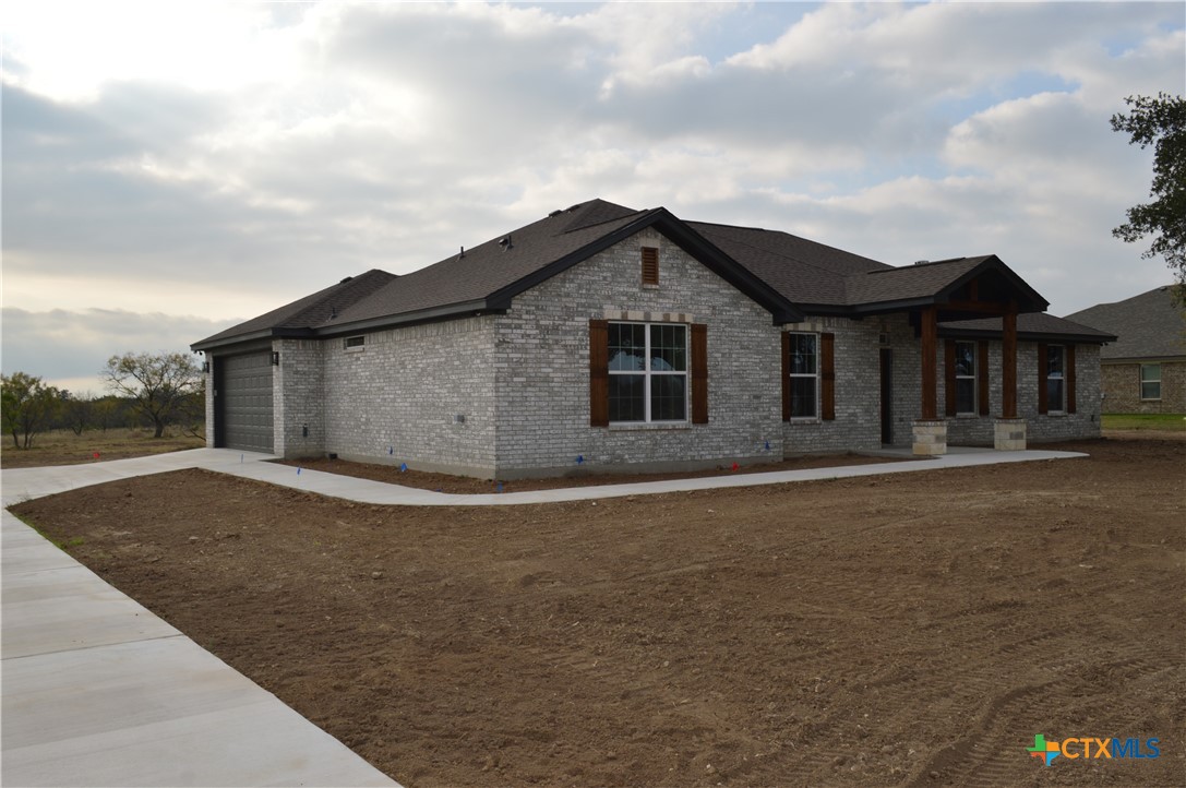 425 County Road 3152 Kempner, TX 76539 - Photo 39 of 48 a front view of a house with a garden