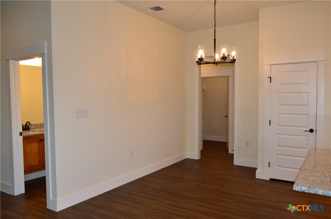 425 County Road 3152 Kempner, TX 76539 - Photo 9 of 48 a view of a room with wooden floor and entryway