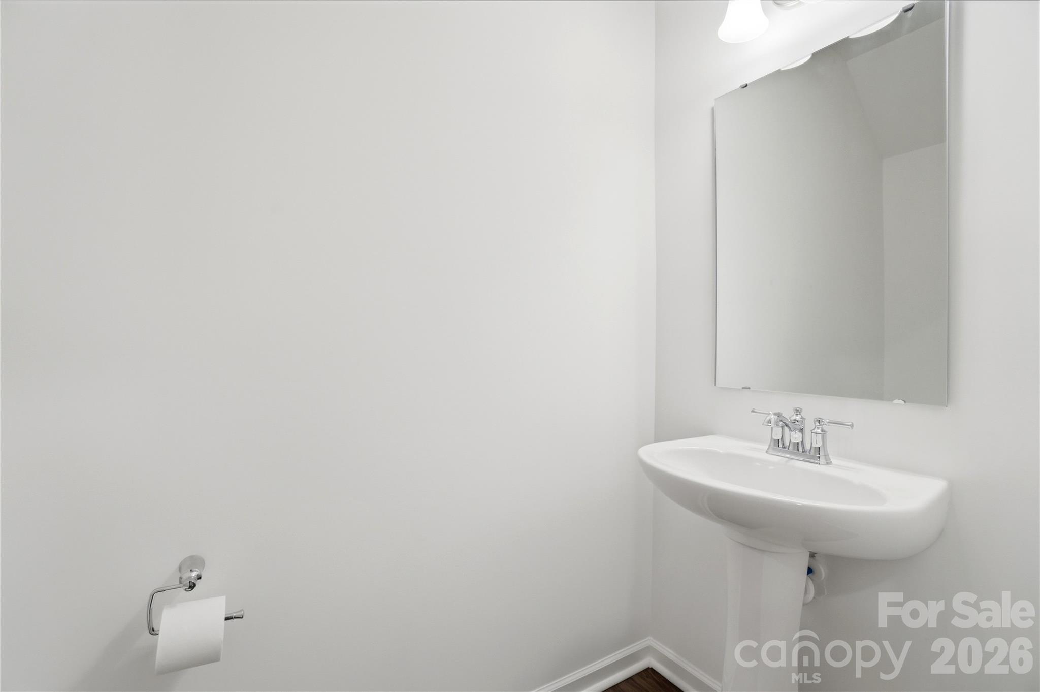 3574 Nimbell Road Monroe, NC 28110 - Photo 15 of 29 a bathroom with a sink and mirror