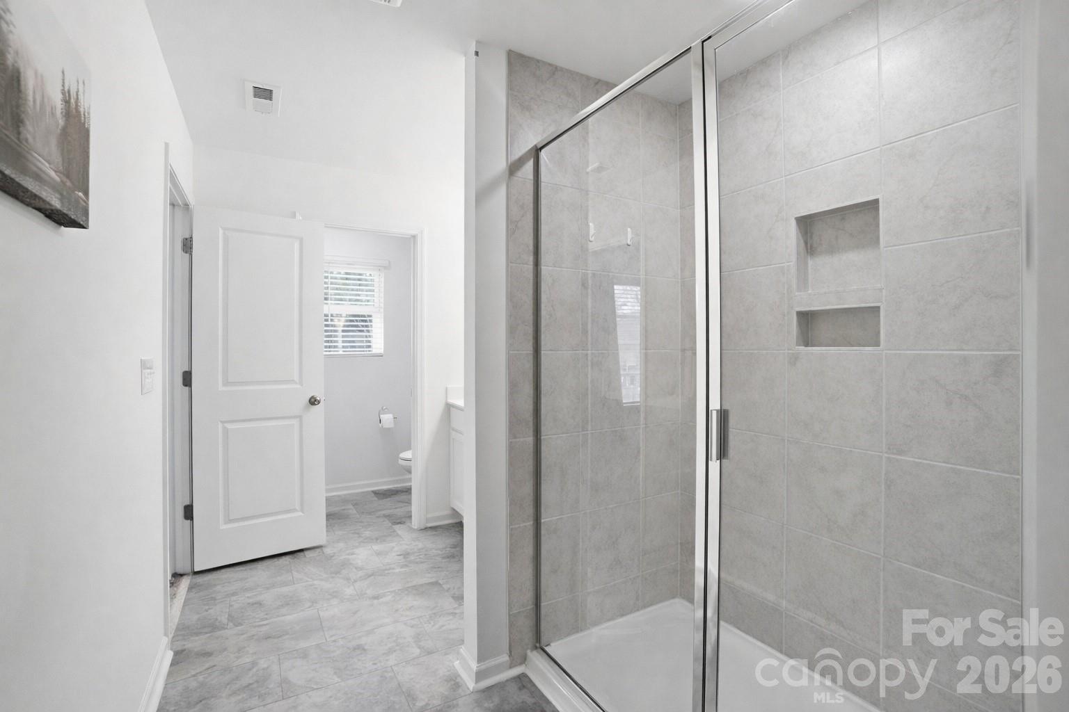 3574 Nimbell Road Monroe, NC 28110 - Photo 20 of 29 a bathroom with a shower and a glass door