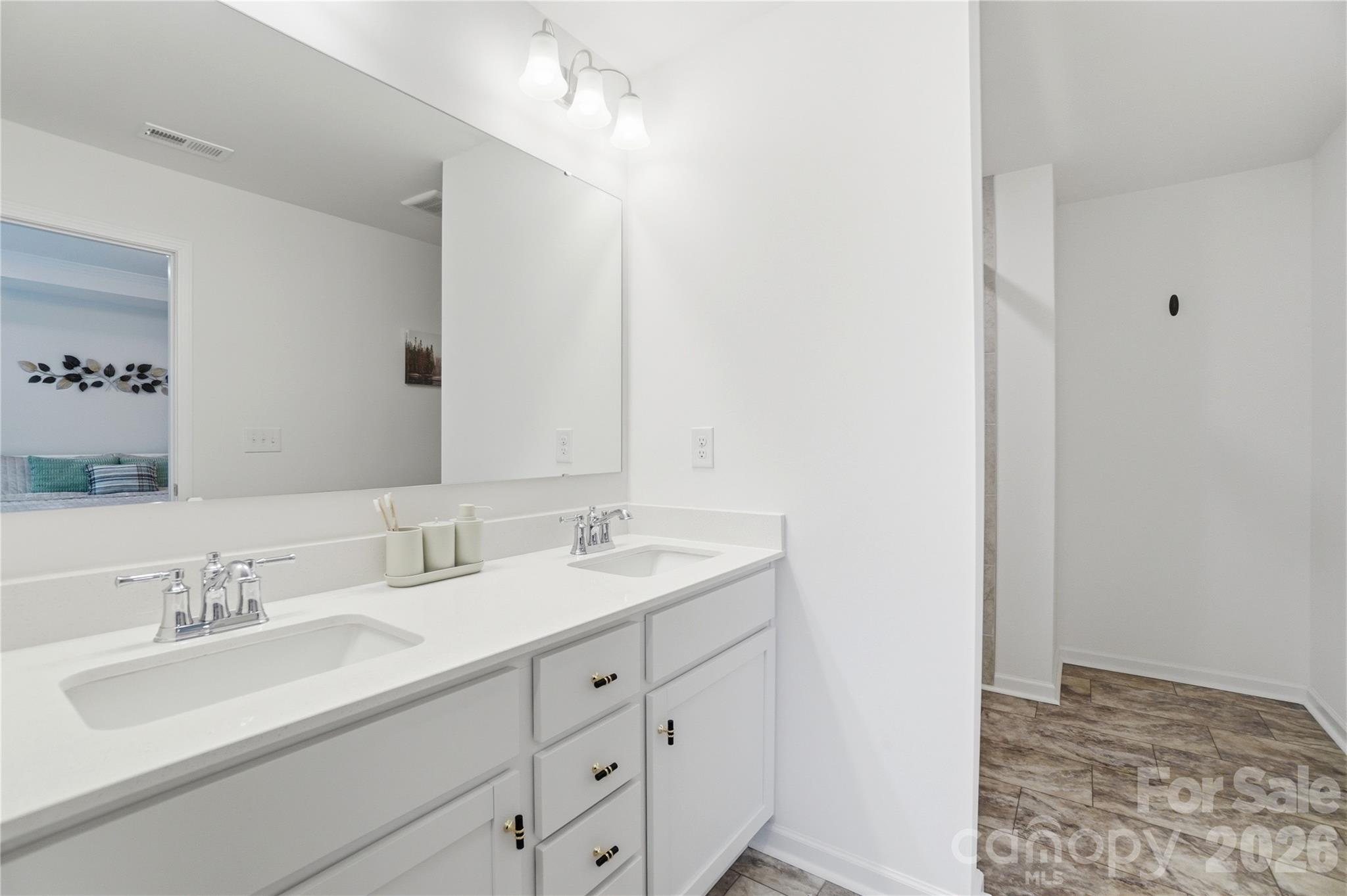 3574 Nimbell Road Monroe, NC 28110 - Photo 21 of 29 a bathroom with a sink double vanity and a mirror