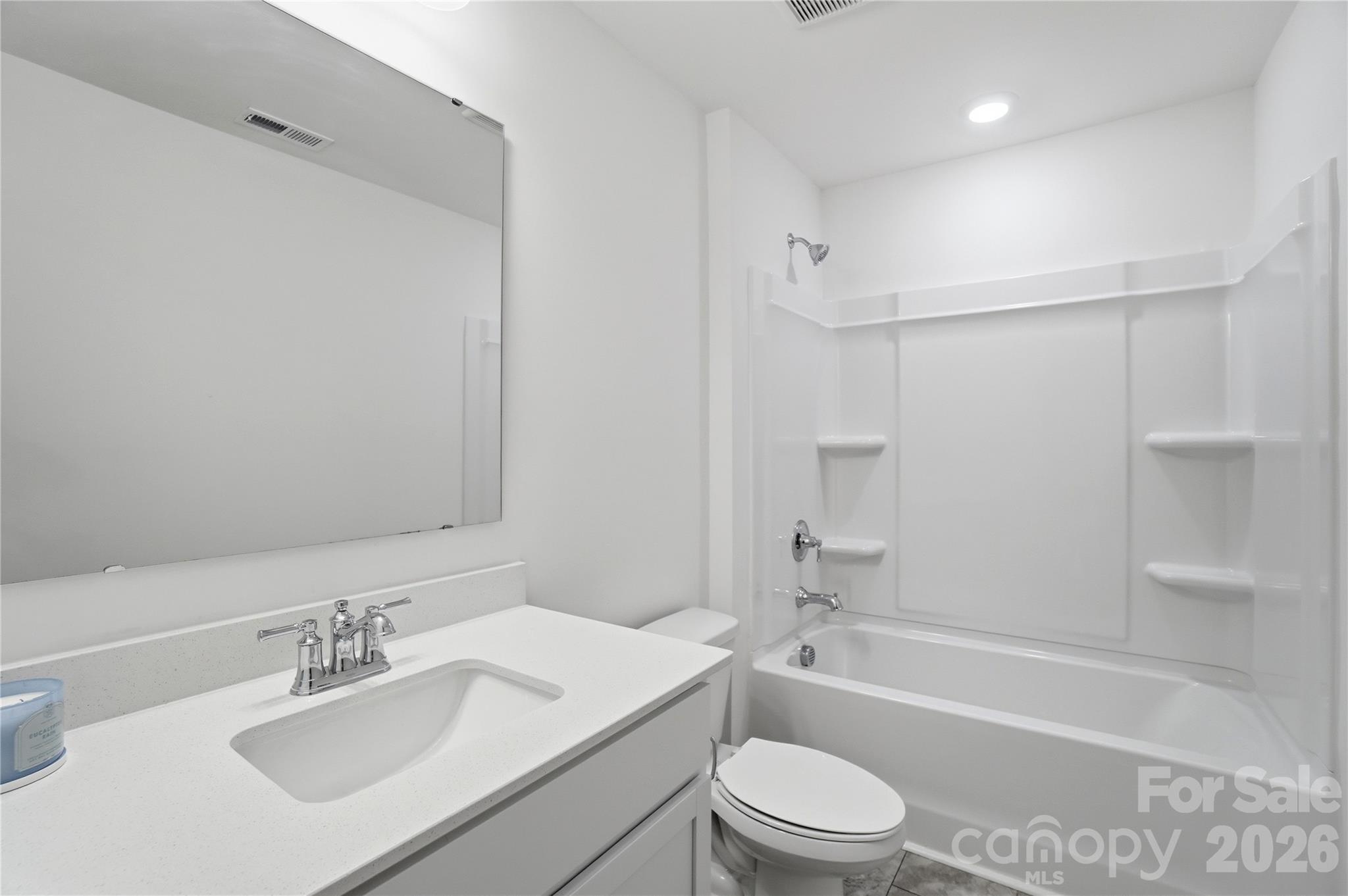 3574 Nimbell Road Monroe, NC 28110 - Photo 22 of 29 a bathroom with a bathtub shower sink vanity mirror and toilet