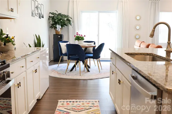 a bedroom with a bed and painting on the wall