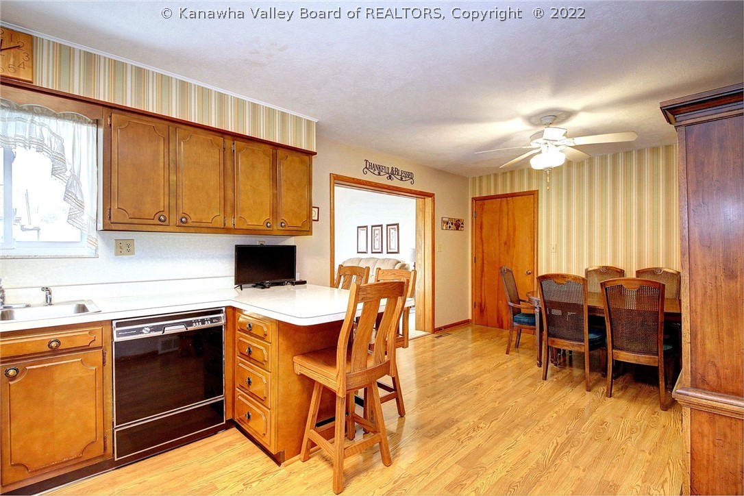 Open kitchen and dining area  opens to beautiful light family room.