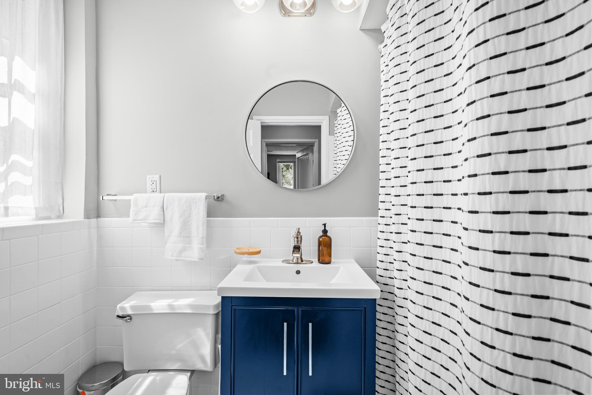 3861 Porter Street Northwest, Unit C285 Washington, DC 20016 - Photo 13 of 23 a bathroom with a sink and a toilet