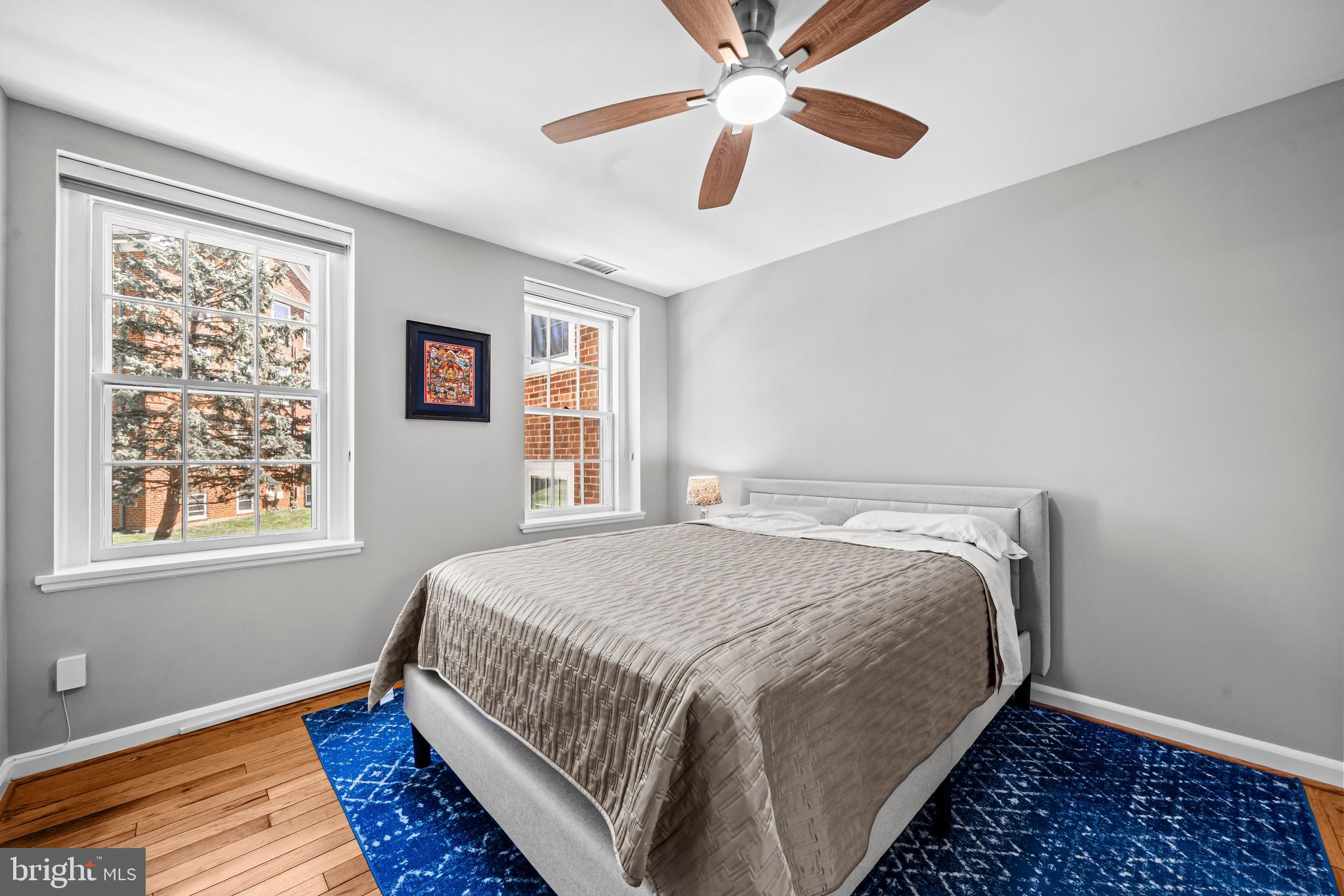 3861 Porter Street Northwest, Unit C285 Washington, DC 20016 - Photo 15 of 23 a bedroom with a bed and a window